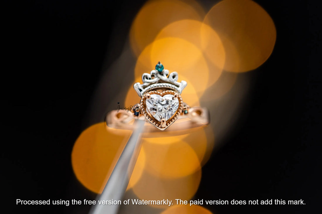 Gold ring with a heart-shaped diamond on a blurred background