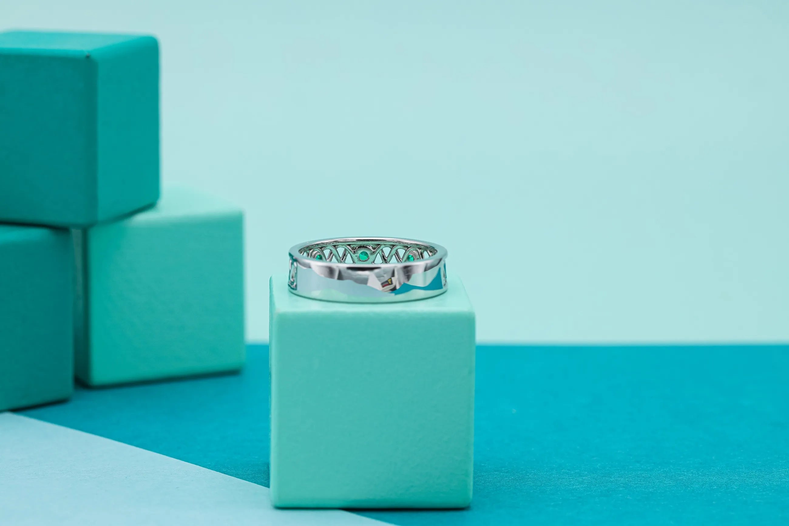Celtic-inspired emerald wedding band