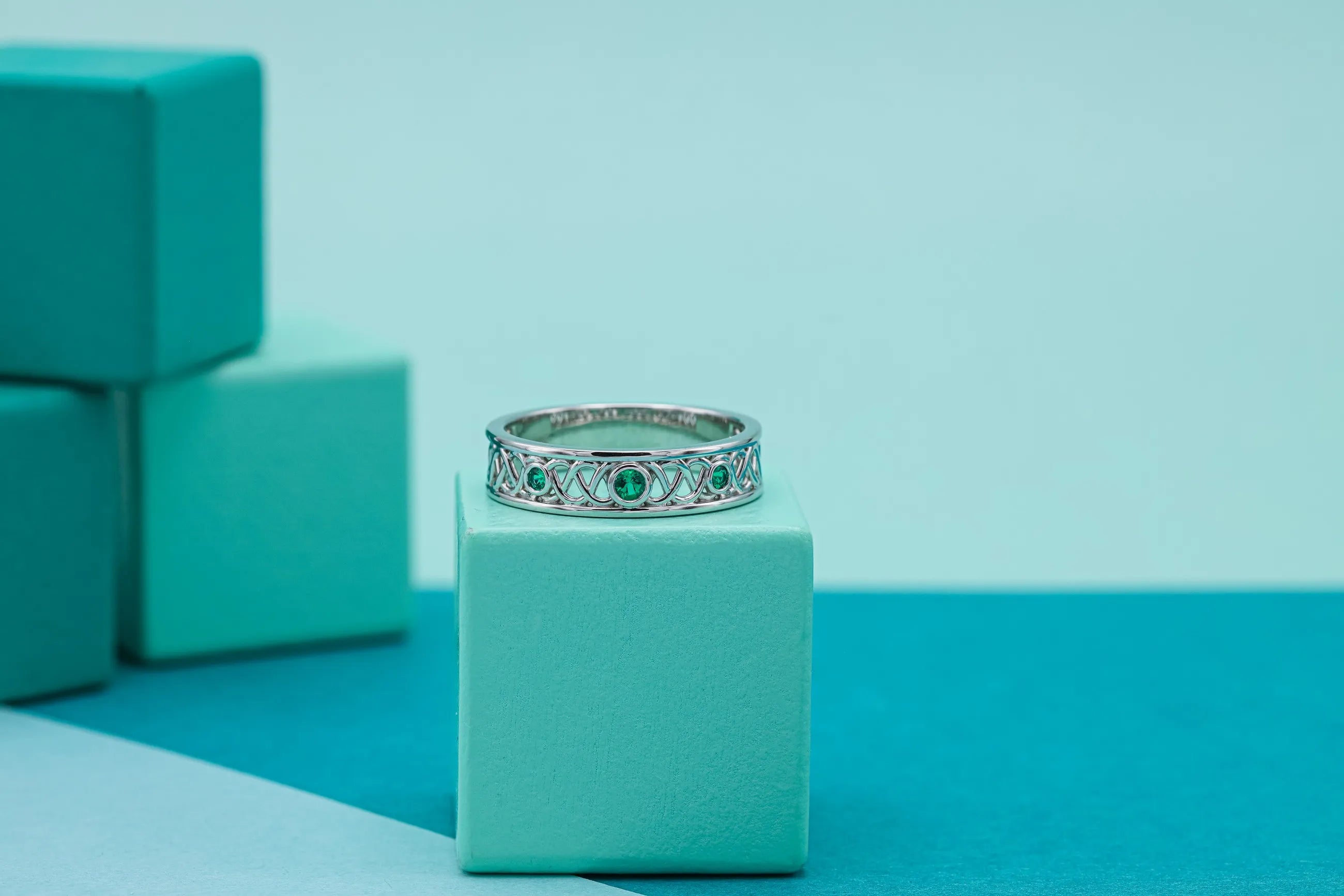 Emerald anniversary ring with filigree