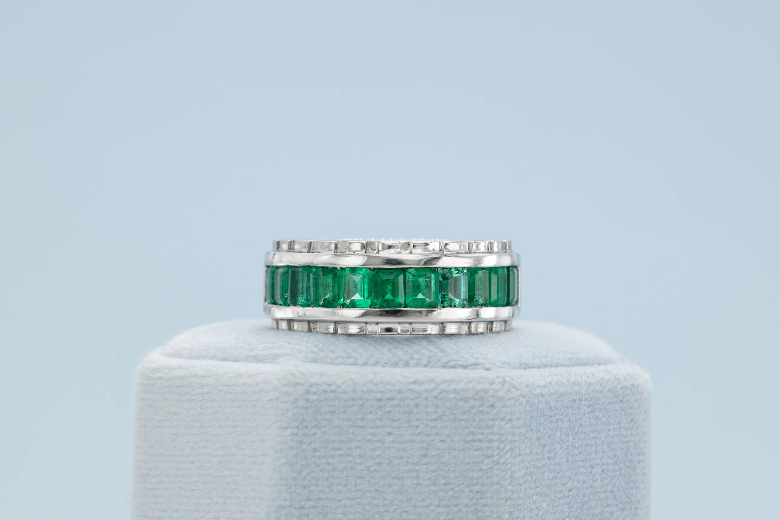 Green emerald eternity band for him and her