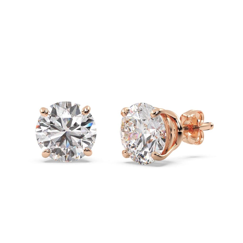 Pair of rose gold diamond stud earrings on a white background
