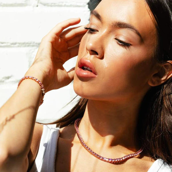 Pink gemstone tennis necklace close-up