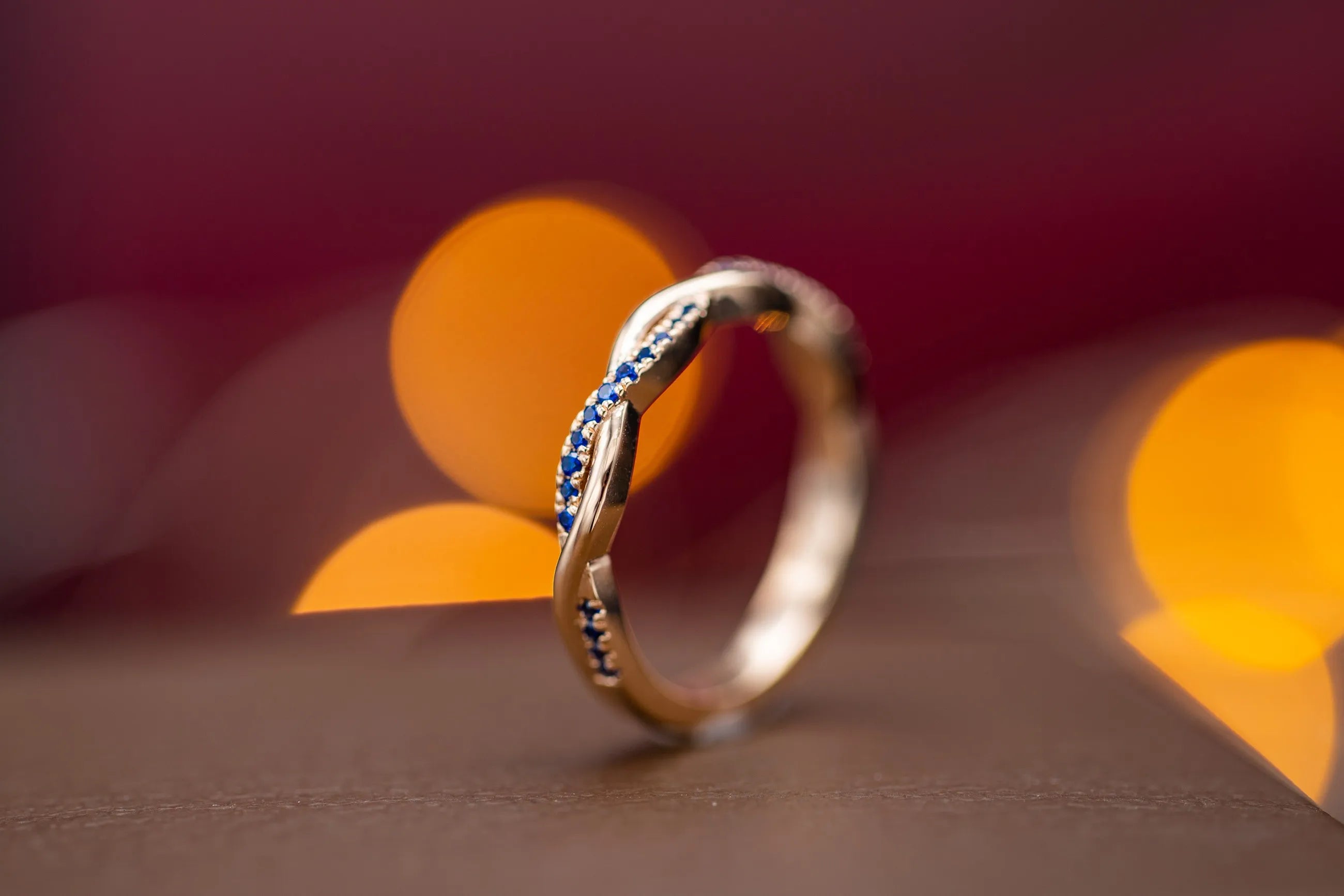 Sapphire and diamond intertwined wedding band