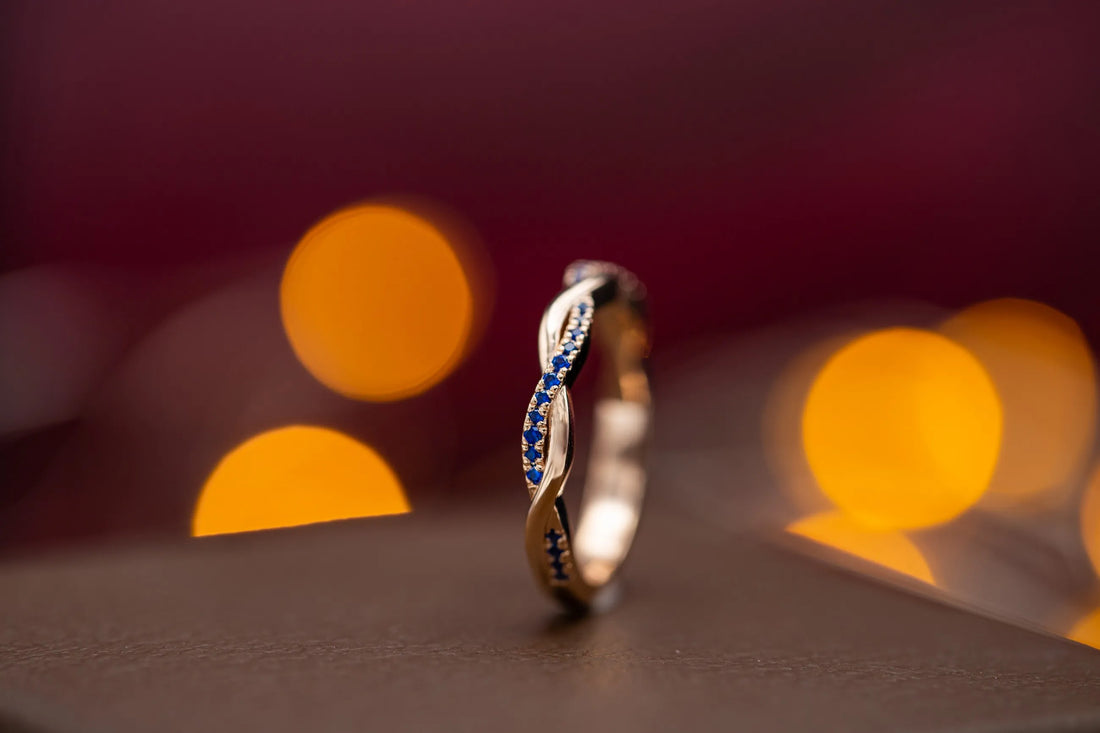 Twisted sapphire and diamond wedding band