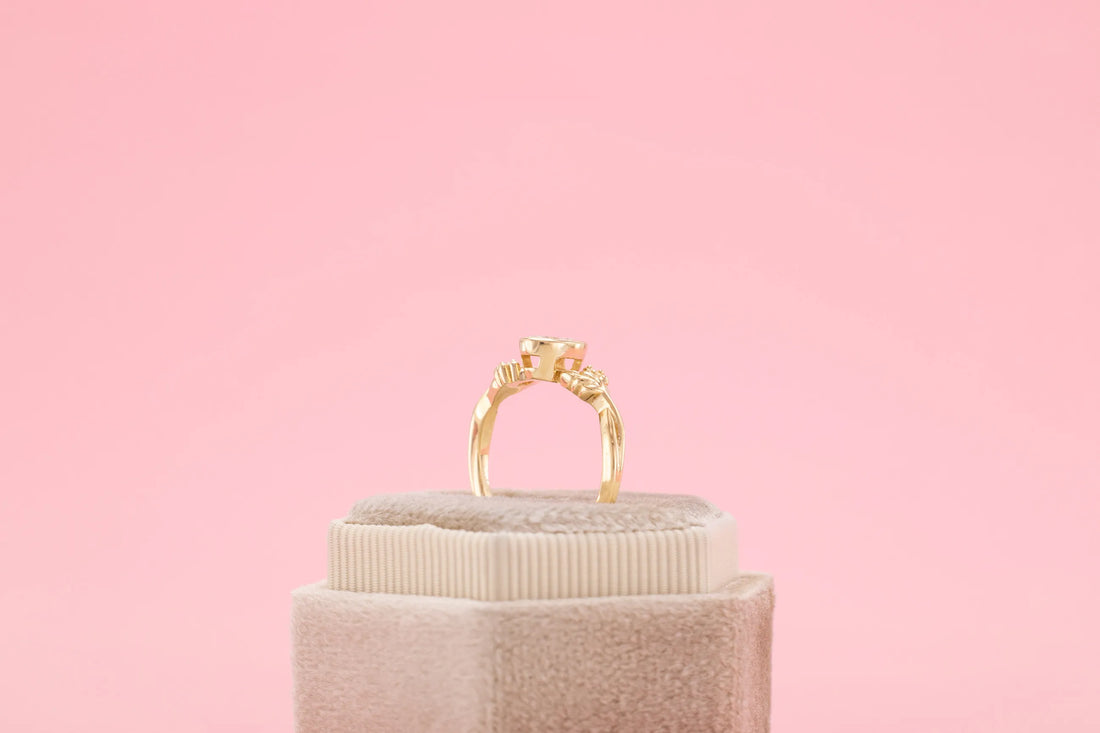 bezel set oval engagement ring yellow gold