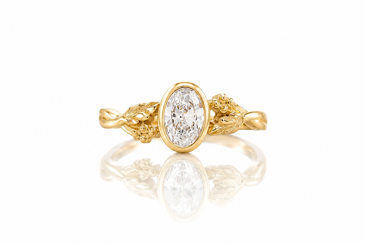 Gold ring with a diamond on a white background